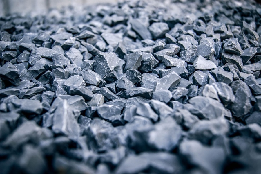A detailed close-up of various crushed stone gravel aggregates, showing different sizes and textures suitable for driveways.